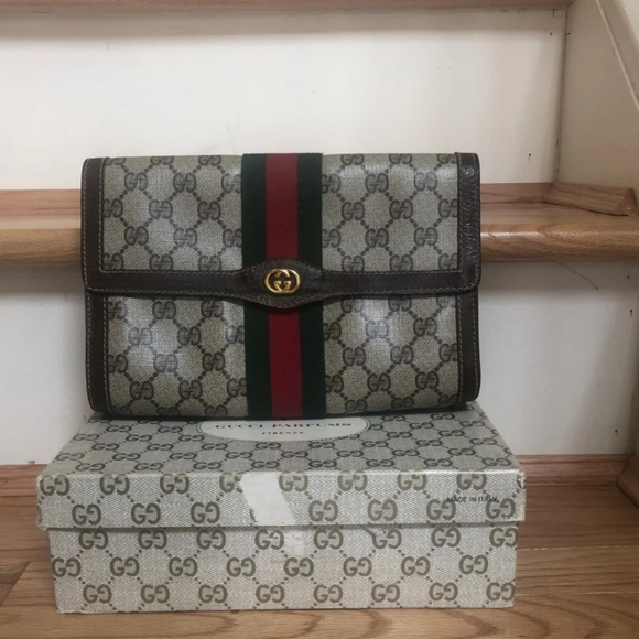 Gucci Handbags - Vintage small Gucci clutch with signature pattern